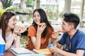 Students group woman and man eating pizza together Royalty Free Stock Photo