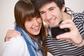 Students - happy teenage couple taking photo Royalty Free Stock Photo