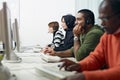 Students with headset in computer lab