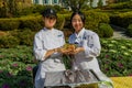 Students holding a dish of pesto pasta Royalty Free Stock Photo