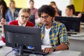 Students at the informatics lecture working together. Smart young people study at the college. Education, college, university, Royalty Free Stock Photo