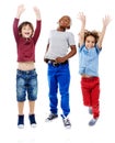 Students, jumping and portrait of children in studio for diversity, friends and playing. Happiness, youth and smile with Royalty Free Stock Photo