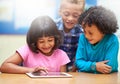 Students, kids on tablet and school for online education, e learning and website or information in group. Happy children Royalty Free Stock Photo