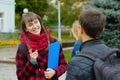 Students learning concept - boy and girl talking about examination passed Royalty Free Stock Photo