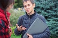 Students learning concept - boy and girl talking about examination passed Royalty Free Stock Photo