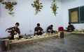 Students learning traditional Bhutanese wood carving