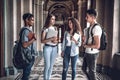 Four beautiful students chatting each other. Royalty Free Stock Photo