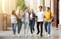 Students life. Friends walking in university campus Royalty Free Stock Photo