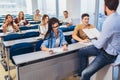 Students listening to professor in the classroom on college Royalty Free Stock Photo