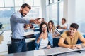 Students listening to professor in the classroom on college Royalty Free Stock Photo