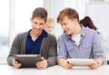 Students looking at tablet pc in lecture at school Royalty Free Stock Photo