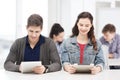 Students looking at tablet pc in lecture at school Royalty Free Stock Photo