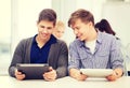Students looking at tablet pc in lecture at school Royalty Free Stock Photo