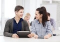 Students looking at tablet pc in lecture at school Royalty Free Stock Photo