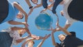 Students make a circle around the globe of the world. The concept of world peace. Royalty Free Stock Photo