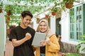 Students male and hijab girl happy when looking to the screen of the tablet