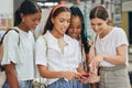 Students, meme and group of women with phone looking at screen. Young girls at university or college on social media Royalty Free Stock Photo