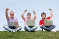 Students outdoors with laptops Royalty Free Stock Photo