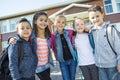 Students outside school standing together Royalty Free Stock Photo