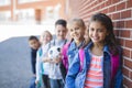 Students outside school standing together Royalty Free Stock Photo