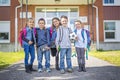 Students outside school standing together Royalty Free Stock Photo