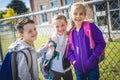 Students outside school standing together Royalty Free Stock Photo