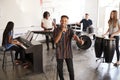 Students At Performing Arts School Playing In Band At Rehearsal With Teacher Royalty Free Stock Photo