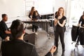 Students At Performing Arts School Playing In Band At Rehearsal With Teacher Royalty Free Stock Photo