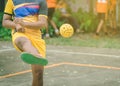 Students playing traditional asian sport game sepak takraw Royalty Free Stock Photo