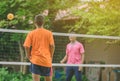 Students playing traditional asian sport game sepak takraw Royalty Free Stock Photo