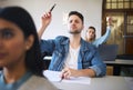 Students question, hand raise and classroom for learning, education or college with notebook on desk. College student Royalty Free Stock Photo