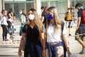 Students queuing at the school entrance wearing mask face