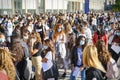 Students queuing at the school entrance wearing mask face