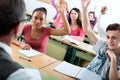 Students raising their hands up Royalty Free Stock Photo