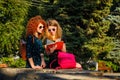 Students read a book in park.