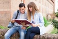 Students reading a book together Royalty Free Stock Photo