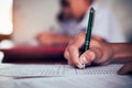 Students reading and writing answer doing exam in classroom with stress Royalty Free Stock Photo