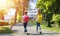 Students With Rucksacks Walking In The Park