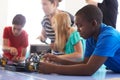 Students In After School Computer Coding Class Building And Learning To Program Robot Vehicle Royalty Free Stock Photo