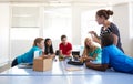 Students In After School Computer Coding Class Building And Learning To Program Robot Vehicle Royalty Free Stock Photo