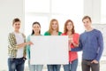 Students at school holding white blank board