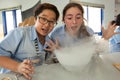 Students in science class, studying the reaction of dry ice Royalty Free Stock Photo