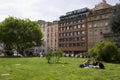 Students seats on the garden facing the Milan University