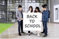 Students showing Back to School text at school Royalty Free Stock Photo