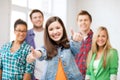 Students showing thumbs up at school Royalty Free Stock Photo