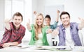 Students showing thumbs up at school Royalty Free Stock Photo