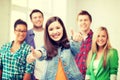 Students showing thumbs up at school Royalty Free Stock Photo