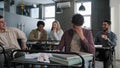 Students sitting in classroom laughing at classmate young frustrated worried guy suffering from ridicule bullying abuse