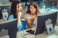Students sitting in a classroom, using computers during class Royalty Free Stock Photo
