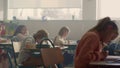 Students sitting at desks in school class. Kids having lesson in classroom Royalty Free Stock Photo